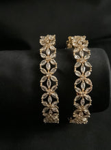 Beautiful floral design oval cut stone bangles