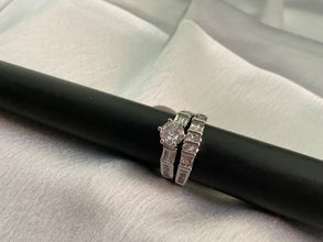 Silver engagement ring with band ring
