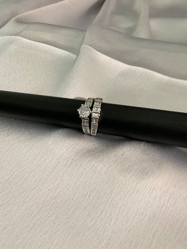 Silver engagement ring with band ring