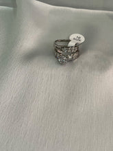 Silver engagement ring with band ring