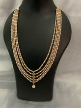 4 layered peach bead necklace