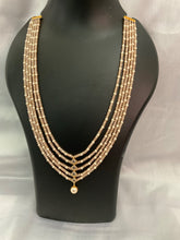 4 layered peach bead necklace